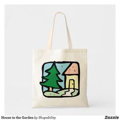 a tote bag with a house in the garden on it