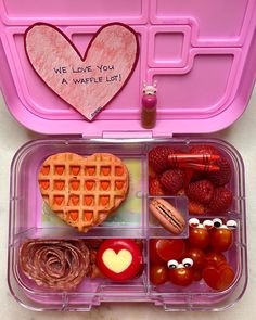 a bento box filled with lots of food and some writing on the lid that says, we love you at waffle lunch