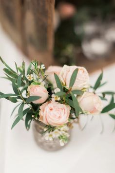 a vase filled with flowers on top of a table