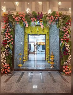 an entrance decorated with flowers and candles