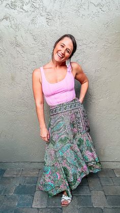 Experience country vibes in the Fern Boho Skirt. Perfect for summer nights, weekends at the lake, or bonfires on the beach, this skirt will have you looking and feeling your best everywhere you go. The beautiful green and pink paisley design with pops of teal adds a splash of color that is sure to turn heads. Not only will you look great, but lightweight material ensures maximum comfort all night long. A flattering waistband and flowing fit further emphasize your figure in all the right ways. Pl Summer Paisley Print Long Skirt, Hippie Mini Wrap Skirt For Summer, Hippie Style Summer Mini Wrap Skirt, Summer Long Skirt With Paisley Print, Hippie Style Mini Wrap Skirt For Summer, Bohemian Green Beach Skirt, Bohemian Green Skirt For The Beach, Spring Paisley Print Beach Skirt, Spring Beach Skirt With Paisley Print