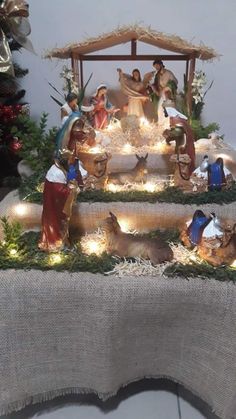 a nativity scene with figurines and lights