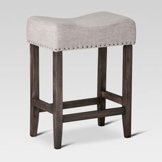 the backless stool is made from wood and fabric