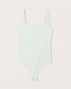 Slim-fitting bodysuit in our new softAF double-layered cotton seamless fabric with square neckline and two-snap bottom closure. White Ribbed Bodysuit For Loungewear, Solid Seamless Bodysuit With Tank Straps, Seamless Solid Color Tank Strap Bodysuit, Seamless Bodysuit With Tank Straps, Solid Seamless Tank Strap Bodysuit, Casual Seamless Bodysuit With Tank Straps, Casual Second-skin Seamless Bodysuit, Summer Ribbed Stretch Bodysuit, Stretch Ribbed Bodysuit For Summer