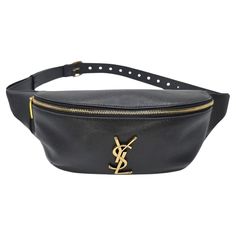 From the Spring/Summer 2023 Collection by Anthony Vaccarello. This retro-cool belt bag was made in Italy and finely crafted of Calf leather exterior with gold-tone hardware features. It has a single zip closure that opens up to a canvas interior with a slip pocket. It features an adjustable leather belt strap. It is also certified authentic by Entrupy! Designer: YVES Saint Laurent Material: Calf Leather Date/Authenticity Code: PLB589959.0723 Production Year: 2023 Bag Measurements: 9.5" x 5" x 3.5" (wxhxd) Belt Length: 44.75" End to End Drop: Adjustable 25.5"-42.5" Interior Lining: Grosgrain fabric Opening/Closure: Single Zip Hardware: Antique gold-tone Includes: Original Box, Dust Bag, Strap Sleeves, Literature, Certificate from Entrupy Overall Condition: Very Good Pre-Loved condition; wit Saint Laurent Lou Crossbody Bag, Yves Saint Laurent Wristlet, Designer Belt Bag With Gold-tone Hardware For Travel, Luxury Travel Belt Bag With Branded Hardware, Designer Leather Belt Bag With Gold-tone Hardware, Luxury Leather Belt Bag With Branded Hardware, Modern Belt Bag With Gold-tone Hardware, Luxury Belt Bag With Branded Hardware, Luxury Belt Bag With Branded Hardware For Everyday Use