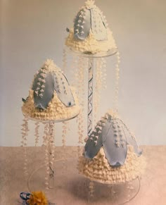 three tiered cakes with blue and white decorations