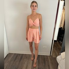 Two Piece Shorts And Crop Set In Peach. Lace Detailing And Cross Front With Spaghetti Strap That Are Adjustable. Shorts Have Zipper On Side. Brand New Never Worn With Tags! Peach Bottoms For Spring Vacation, Spring Peach Bottoms For Loungewear, Summer Beach Peach Bottoms, Casual High Waist Peach Bottoms, Chic Peach Bottoms For Summer, Casual Peach Bottoms For Summer, Chic Peach Summer Bottoms, Peach Shorts For Summer, Casual Peach Short Bottoms