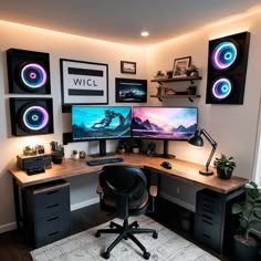 a computer desk with two monitors and speakers