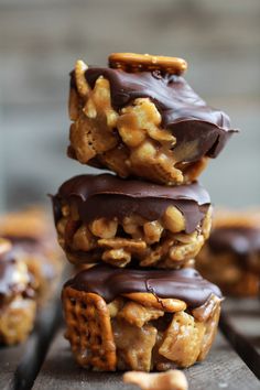 chocolate covered cookies stacked on top of each other with walnuts and pretzels