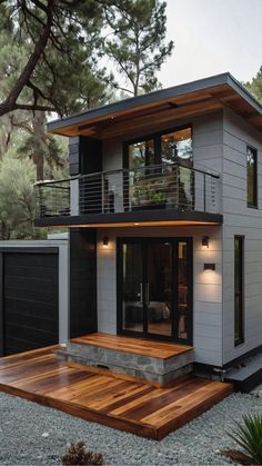 a modern house with wooden decking in the yard