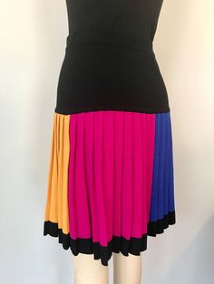 "Fun 80s Vintage knit mini skirt Color blocked Pleated tag: Liz Claiborne/size PS measurements; waist-28-32\" stretchy total length-20\" material: wool rayon blend knit color: yellow, black, red, hot pink, electric blue condition:good, has mended spots-please see last close-up pictures" Color Block Fitted Mini Skirt, Fitted Color Block Mini Skirt, Fitted Multicolor Color Block Skirt, Multicolor Retro Mini Skirt, Multicolor Retro Stretch Skirt, Retro Multicolor Fitted Mini Skirt, Knit Mini Skirt, Pleat Skirt, 80s Vintage