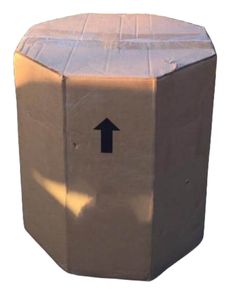 a cardboard box with an arrow painted on the front and back side, sitting upright