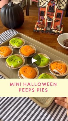 mini halloween peeps pies on a tray with candy in the background and an image of a gingerbread house