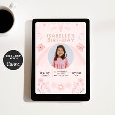 a tablet with a birthday card on it next to a cup of coffee and a mug