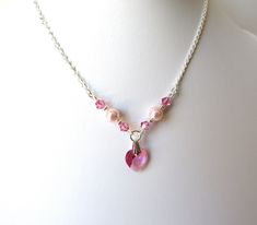 A beautiful necklace that's perfect for weddings, holidays or any special occasion! ♥ All jewelry comes in a gift box and is ready to give! ♥ This necklace is handmade using: ~Delicate Sterling Silver 1.7mm diamond cut curb chain (CHOICE OF LENGTH) ~Swarovski pink rose crystals ~Swarovski pink rose pearls ~Swarovski pink rose heart shaped crystal (10mm) ~INCLUDES 2 INCH GROW CHAIN EXTENSION for adjustable sizing, embellished with silver heart charm ---------- There are many more unique items, in Pink Heart Beads Necklace For Wedding, Pink Charm Necklaces For Valentine's Day Birthday, Pink Charm Necklace For Valentine's Day Birthday Gift, Heart Charm Necklace For Bridesmaid Gift On Valentine's Day, Pink Heart Charm Necklace For Wedding, Adjustable Heart Beads Necklace For Wedding, Pink Heart-shaped Jewelry For Birthday Gift, Pink Heart Necklace For Wedding, Adjustable Necklace For Bridesmaid Gift, Valentine's Day