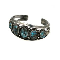 Attractive Navajo cuff of graduated turquoises set in silver with twisted wire and shot work. Great for men or women. Interior 2.5 x 2", USA 1940's. The bracelet measures 7.5" in length and is 1 3/8" wide. The opening on back is 1". Interior measure is 6.25". Excellent condition. Indian Artificial Jewellery, Twist Jewelry, Vintage Cuff Bracelet, Online Gold Jewellery, Silver Jewellery Indian, Antique Bracelets, American Indian Jewelry, Jewellery Sketches, Indian Jewellery Design