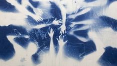 a painting with blue and white paint on it