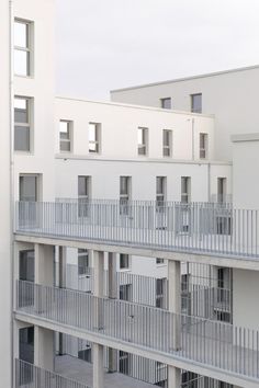 an apartment building with balconies and balconies on each floor