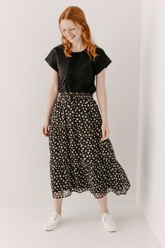 Looking for a little something floral this summer? The 'Stephanie' Skirt is the perfect way to incorporate festive florals subtly. This gorgeous skirt features a tiered silhouette and elastic waistband to keep you comfortable all day. Pair the 'Stephanie' with a simple top and sneakers for heading to that local greenhouse or grabbing brunch with friends! Self & Lining 100% Polyester Hand Wash Cold Do Not Bleach Lay Flat to Dry Cool Iron if Needed Fully Lined Model Height 5'5" | Wearing Size Smal Fitted Tiered Denim Skirt With Lining, Modest Relaxed Fit Bottoms For Spring, Modest Relaxed Tiered Skirt, Modest Tiered Skirt, Modest Bottoms For Day Out, Fitted Modest Bottoms For Spring, Spring Lined Denim Skirt For Work, Spring Modest Workwear Bottoms, Everyday Long Skirt For Spring