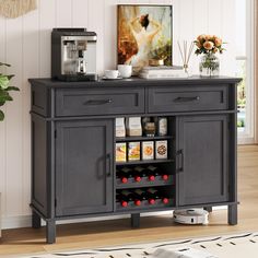 a kitchen with a coffee maker and wine rack on top of the sideboard next to a potted plant