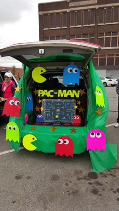 the back end of a car decorated to look like pac - man and other characters