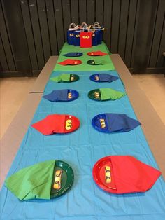 the table is set up with plates and napkins for an ocean themed birthday party