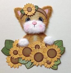 a stuffed cat with sunflowers on it's head