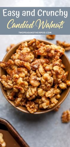 a bowl filled with candied walnuts on top of a table