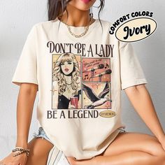 Feel like a true rockstar with the "Don't Be a Lady, Be a Legend" Comfort Colors shirt featuring Stevie Nicks from Fleetwood Mac. This vintage-inspired tee is a must-have for any music lover or concertgoer looking to channel their inner legend. Show your love for Stevie Nicks with this stylish and comfortable t-shirt that is sure to become a staple in your preppy and classic rock-inspired ensembles. 💥I. ABOUT PRODUCT - There are many ways to express your personality and wearing our products with eye-catching patterns and meaningful words is one of the ways. Comfortable, casual, and loose-fitting, our products will surely become one of your favorites. Made of cotton, safe and comfortable for anyone. - Using a unique water-based dyeing process where the image is permanently adsorbed on the Vintage Slogan T-shirt For Concerts, Retro Slogan Top For Concerts, Retro Slogan Tops For Concerts, Retro Concert T-shirt With Letter Print, Retro Slogan T-shirt For Concerts, Retro Letter Print T-shirt For Concert, Music-themed Slogan Tops For Concerts, Be A Lady, Spring Tees