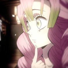 a girl with pink hair and green eyes looks at something in the distance while holding her hand up to her face