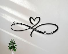 there is a wall decoration with the name james and an infinite heart