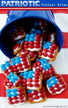 red, white and blue cookies are stacked on top of each other in a bucket