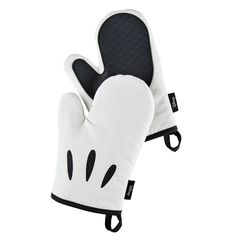 Bring the timeless magic of Disney Mickey Mouse to your kitchen with this 2-piece set of oven mitts from Disney Home, a line of kitchenware inspired by Disney's early-era black-and-white animated masterpieces. The oven mitts - designed to resemble Mickey’s iconic cartoon gloves - help home chefs show off their playful side and love for the world’s most famous mouse while cooking up their own culinary charm. Both pot holders (one for each hand) are made with a soft cotton interior, protective pol Mickey Mouse Gloves, Cartoon Gloves, Iconic Cartoon, Cotton Textiles, White Oven, Kitchenware Design, Disney Free, Oven Gloves, Disney Home