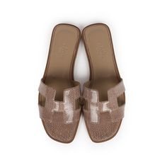 This pair of Oran sandals is in Argile Shiny Varanus Niloticus Lizard with tonal stitching, H cutout detail, natural leather soles and natural leather heels in a size 37.5 EU.Origin: ItalyCondition: New and never wornAccompanied by: Hermes box, dustbags, ribbon and CITESSize: 37.5 EU Almond Toe Sandals With Leather Sole, Beige Flat Heel Sandals With Leather Footbed, Open Toe Beige Mules With Leather Footbed, Beige Open Toe Mules With Leather Footbed, Beige Sandals With Leather Lining And Round Toe, Beige Leather Sandals With Rubber Sole, Beige Round Toe Sandals With Leather Lining, Beige Closed Toe Sandals With Stitched Sole, Beige Open Toe Sandals With Stitched Sole