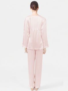 Made from the luxurious mulberry silk, the long silk pajama set decorated with a feminine ribbon under the bust brings a visual hi lite. A modern yet elegant creation that lends pure opulence to your nightwear collection. Feminine Satin Sleepwear Sets, Elegant Sleepwear For Pajama Party, Elegant Satin Sleepwear For Pajama Party, Elegant Satin Sets For Pajama Party, Feminine Silk Sleepwear, Feminine Silk Sleepwear For Loungewear, Chic Silk Sleepwear For Wedding Night, Elegant Pink Loungewear Set, Elegant Satin Sets With Long Pants