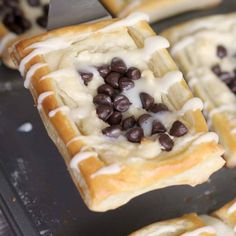 chocolate chip cookies and cream puff pastry on a baking sheet