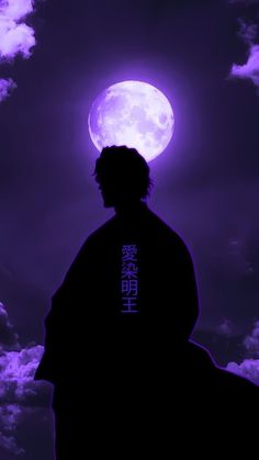 a man standing in front of a full moon