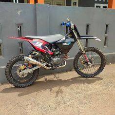 a dirt bike parked in front of a building