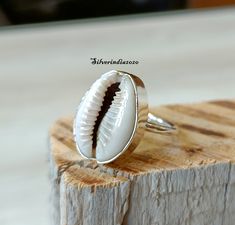 Cowrie Shell Ring*925 Sterling Silver Ring*Handmade Ring*Dainty Ring*Shell Ring*Statement Ring*Beautiful Ring*Women Ring*Gift For Her ---------------------------------------------------------------------------------------------------------------------------------------------------- Cowrie Shell Ring, Handmade Ring, Gemstone Ring, Statement Ring, 925 Silver Ring, Boho Ring, Dainty Ring, Women Ring, Gift For Her All my Designs are original. Cowrie Shell Ring This is a classy fine hand-crafted stur Nickel-free White Stackable Rings As Gift, White Hallmarked Stackable Rings As Gift, White Stackable Wedding Rings Stamped 925, Handmade White Toe Ring, Handmade Sterling Silver Stackable White Rings, Handmade White Sterling Silver Stackable Rings, White Toe Ring As A Gift, Handmade White Stackable Open Rings, Handmade White Open Stackable Rings