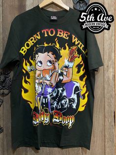 Wild at Heart: Betty Boop Born to Be Wild Single Stitch Black T-Shirt - Vintage Band Shirts Themed Short Sleeve Streetwear T-shirt, Themed Character Print T-shirt For Streetwear, Themed Cartoon Print T-shirt For Streetwear, Betty Boop T Shirt, Biker Rallies, Vintage Band Shirts, Flapper Era, Tshirt Streetwear, Betty Boop Cartoon