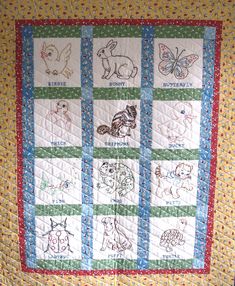 a quilted wall hanging with animals on it