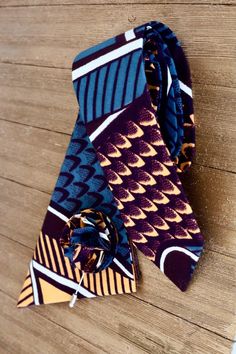 A traditional-style skinny necktie measuring about 2.5" x 58" made with multicolored African fabric. Please note that there may be factors that could affect the perceived color of an item such as computer/phone screens. Also, due to different patterns and how the fabric is cut, each necktie made may look slightly different. This however, only makes your tie more unique! Phone Screens, African Fabric, Phone Screen, Different Patterns, Chanel Boy Bag, Necktie, Traditional Style, Neck Tie, Computer