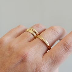 A great simple textured band ring to add to your daily stack! Fabulous alone or stacked, this baby is made in 14K Gold Filled and meant to last so no need to take it off. It is made to order to fit any size, top knuckle or base of your finger. Each ring will have it's own unique pattern like the ones shown, and will not be exactly the same in pattern. Ring is 3.8mm wide AVAILABLE IN ANY SIZE, please specify your size or sizes when ordering! +Ring holder by the amazing Lenny Mud : https://www.ets Stackable Recycled Gold Midi Rings For Anniversary, Stacked 14k Yellow Gold Rings, Adjustable Yellow Gold Thick Band Stackable Rings, Adjustable Thick Band Yellow Gold Stackable Rings, Adjustable Thick Band Stackable Rings In Yellow Gold, Gold Stacked Midi Rings Minimalist Style, Gold Stacked Minimalist Midi Rings, Stacked Yellow Gold Rings As A Gift, Minimalist Stacked Gold Midi Rings