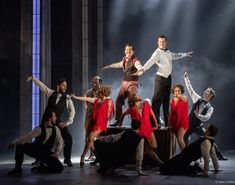 a group of people standing on top of a stage