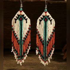 Approx 5" Handcrafted Beaded Dangle Earrings Southwestern Boho Style Golden Orange , Teal , Black , And Natural White Beads Most Of My Other Earrings Are Dangle Types (Like These) That Can Be Upgraded To Solid Sterling Silver Or 14k Gold Filled Wires. I Also Have Some Extra Stainless Steel Wires And Gold Tone Wires So I Can Customize These For You At No Cost If You Prefer One Of Those. I Have A Background In Jewelry Design In Nyc And I Buy My Ear Wires From A Legitimate Metal Source Jewelry Supp Traditional Beaded Earrings With Fringe For Festivals, Southwestern Multicolor Fringe Earrings, Traditional Beaded Fringe Earrings For Festival, Southwestern Dangle Beaded Earrings For Festivals, Southwestern Style Dangle Beaded Earrings For Festivals, Southwestern Style Beaded Dangle Earrings For Festival, Southwestern Beaded Earrings With Tassels For Festival, Southwestern Colorful Beaded Earrings For Festivals, Colorful Beaded Southwestern Earrings For Festival