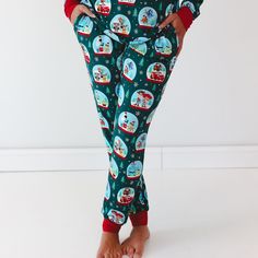 Close up image of female model wearing the Disney A Very Pixar Christmas Women's Pajama Pants with hands in pocket Pixar Christmas, Womens Pj Pants, Emerald Green Background, Disney And Pixar, Sibling Outfits, Womens Pajamas Pants, Peppermint Mocha, Character Home, Women's Nightgowns