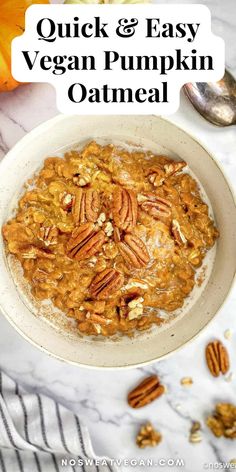 a bowl of oatmeal with pecans and pumpkins in the background