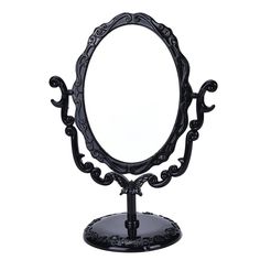 an ornately designed mirror on a stand against a white background with no one in it