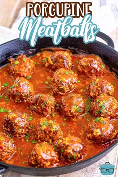 meatballs with tomato sauce and parsley in a cast iron skillet