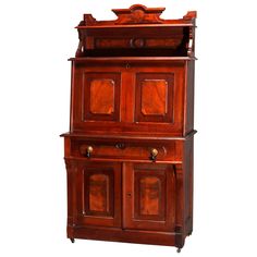 an old fashioned wooden cabinet with two doors